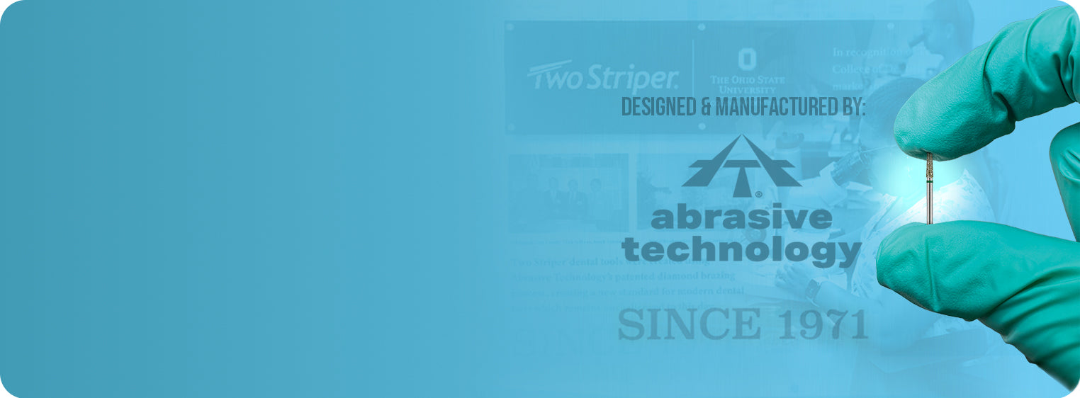 A gloved hand holding a small dental bur against a blue background, featuring Abrasive Technology branding while referencing Two Striper legacy.slider_item_Qp8x77